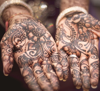 A person’s palms with tattoos